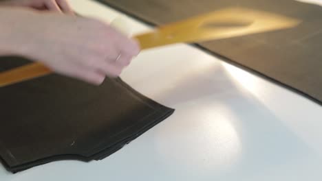 woman cutting fabric for sewing