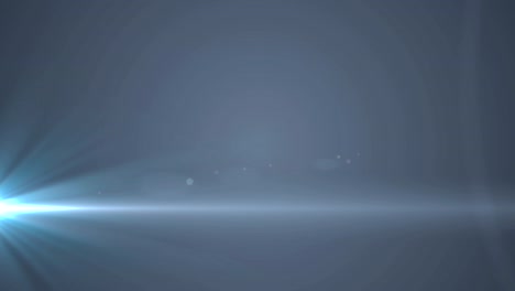rayos azules brillantes de luz que se mueven contra un fondo gris