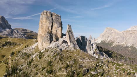 cinematic establishing shot above cinque torri, italian dolomites