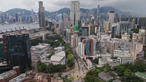 Aerial-over-the-skyscrapers-of-Kowloon,-Hong-Kong,-China