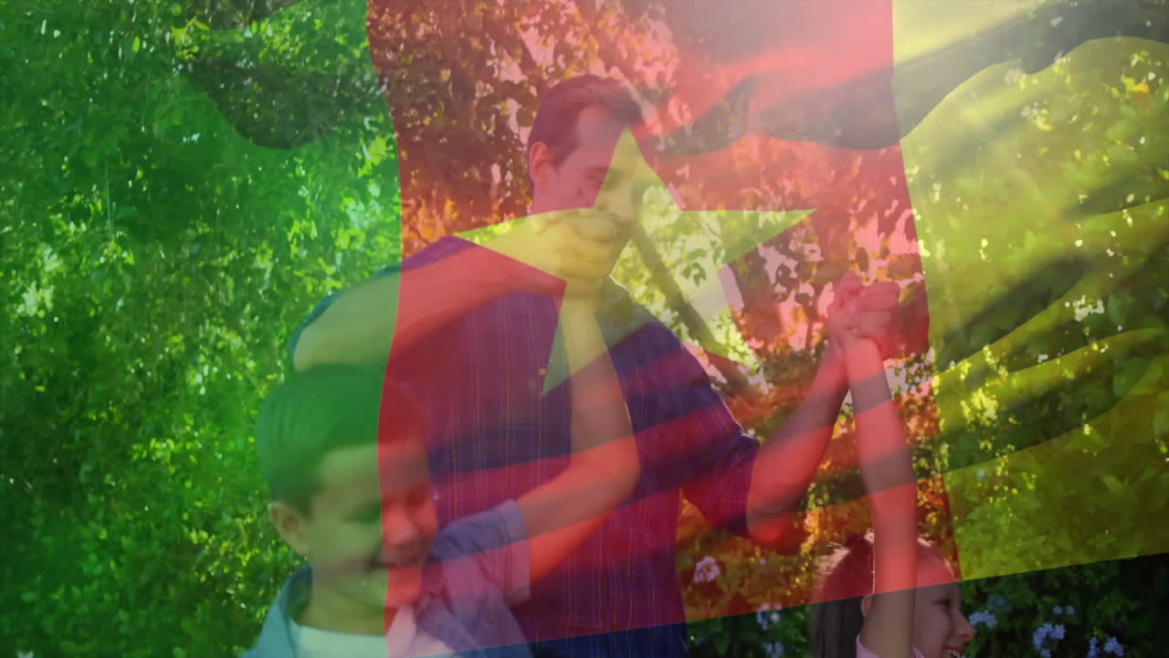 Holding hands outdoors, family with Cameroon flag colors in animation overlay