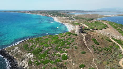 Paragliding-at-Capo-San-Marco-in-San-Giovanni-di-Sinis,-Sardinia,-Italy---4k-Aerial-Reveal