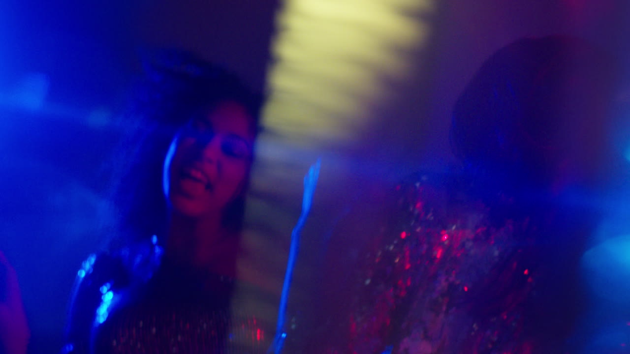 Close Up Of Two Women In Nightclub Bar Or Disco Dancing With Sparkling Lights 4