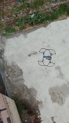 flying over an abandoned factory with a drone. industry in ruins.. vertical video
