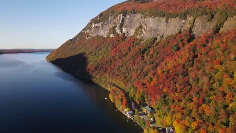 beautiful aerial drone footage of the fall leaves on and around mount hor, mount pisgah, and lake willoughby during peak autumn foliage at willoughby state forest in westmore, vermont