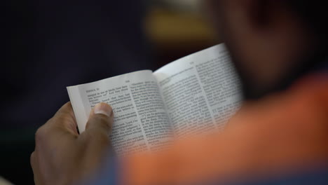 black prisoner african american inmate reading a bible in prison jail shot on sony a7iii mirrorless camera