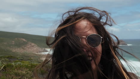 happy young girl with sunglasses enjoying the nature and the life