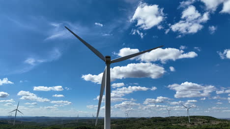 up of wind turbine blades rotating with blue