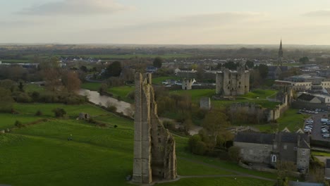 clean aerial pan of st mary's abbey and trim castle in the background