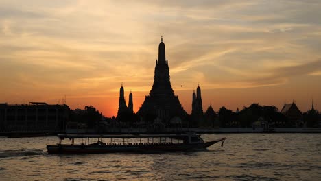 time-lapse of sunset behind temple silhouette