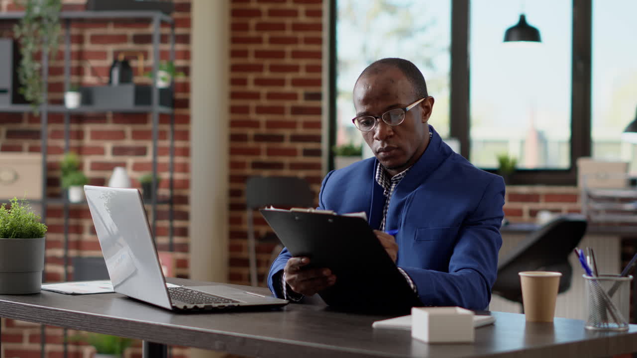 Project manager analyzing statistics plan with application report