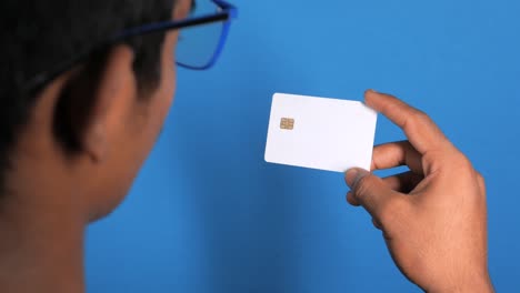 person holding a blank credit card