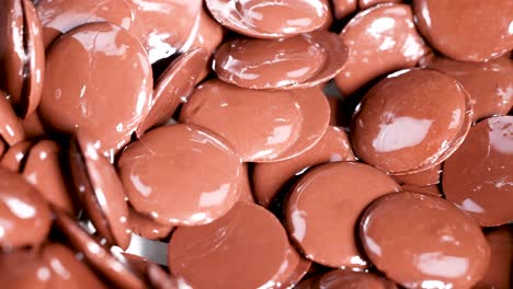 close-up view of chocolate buttons moving