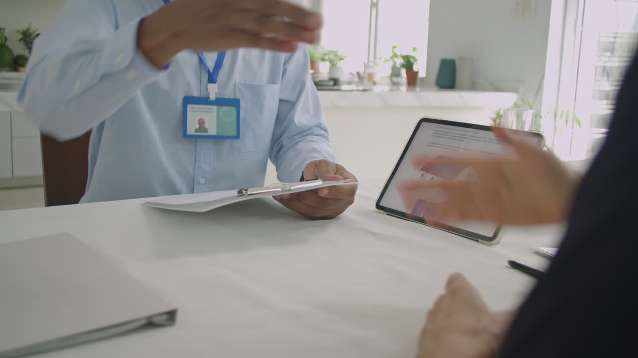 Multi-Ethnic Business People Shaking Hands after Signing Contract