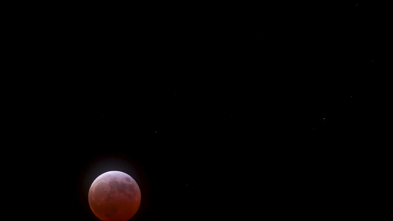 Beginning of the maximum Total Lunar Eclipse on March 14th, 2025 as the moon turns blood red