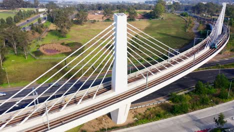 sydney metro train crossing an overpass, australia