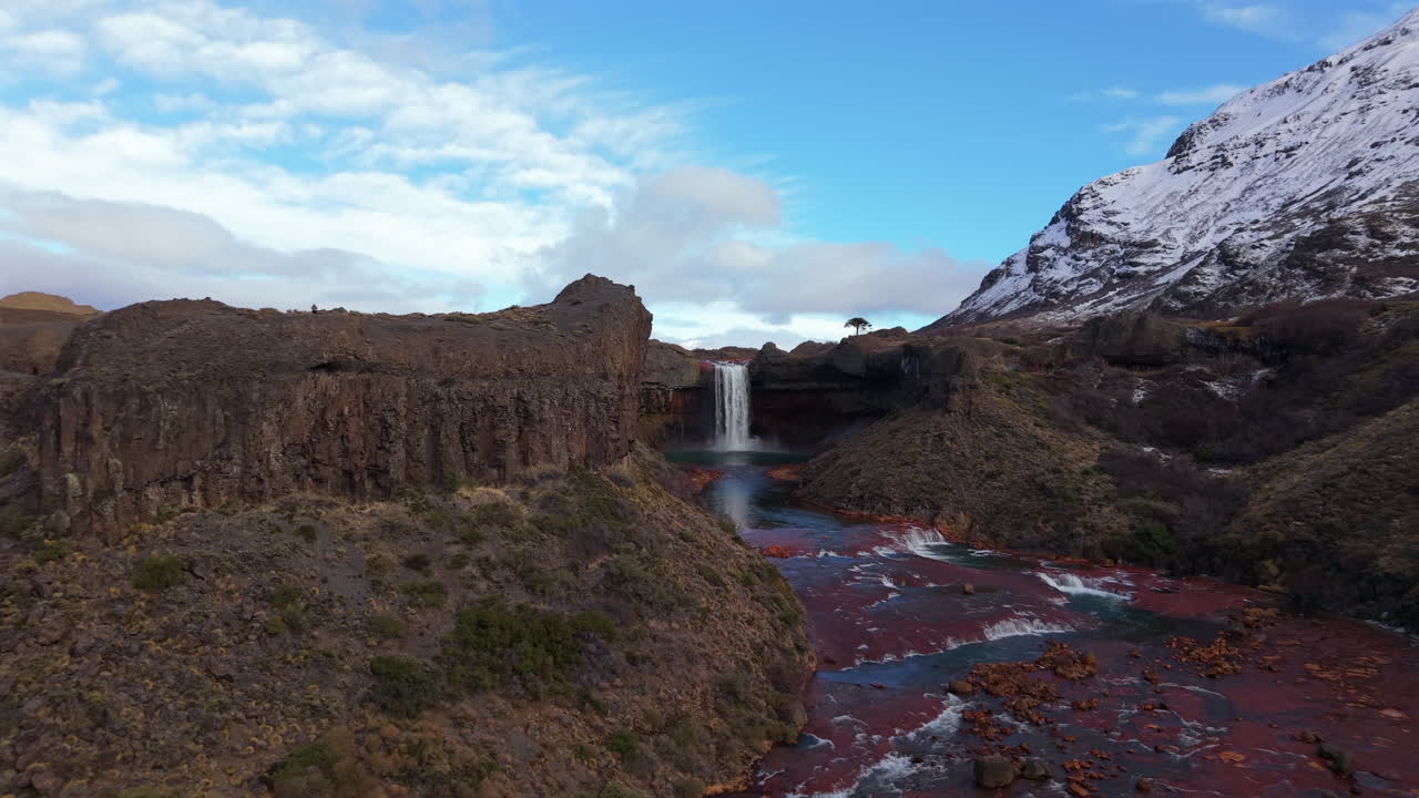 A slow cinematic movement reveals Salto del Agrio waterfall in Neuquén, Argentina, in all its beauty