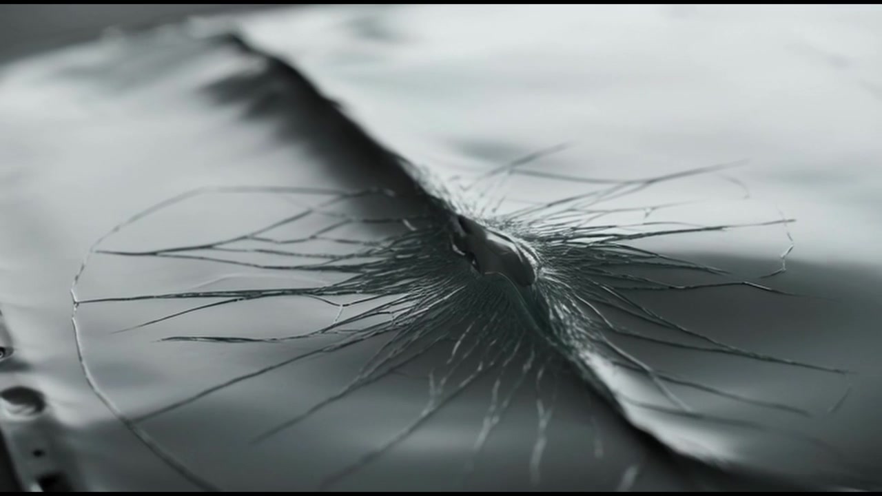 Close-up of a Car Roof Surface Cracking and Breaking