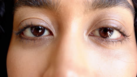 close-up of person's eyes, focusing on natural beauty and expression, at home