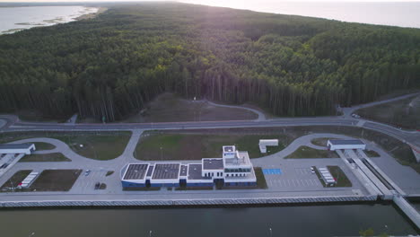 Aerial-backwards-shot-newly-built-ship-canal-between-Gdansk-Bay-and-Vistula-Lagoon-in-Poland-at-sunset