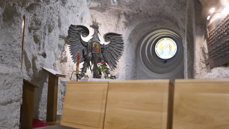 аncient coat of arms with the icon in a stone church in budapest