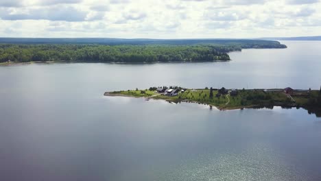 aerial view of lake and island houses