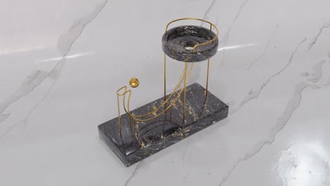 marble and gold geometric decorative stand