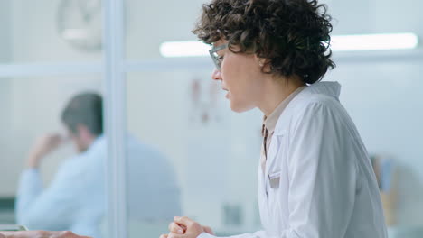 elderly woman speaking with female doctor