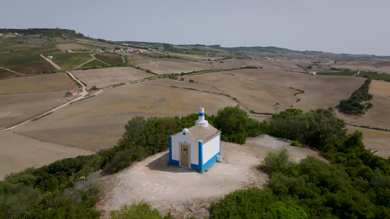 Aerial 180&ordm; close shot of ancient chapel of Nossa Senhora do Monte in Arruda dos Vinhos in Portugal
