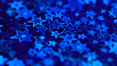 holiday stars lights bokeh. holographic stars sparkle with blue neon ligh. christmas background