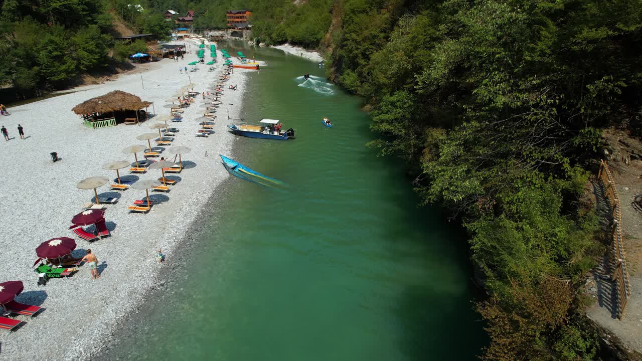Tourists Enjoy Shala River’s Alpine Beauty in Summer: Sunbathing, Traditional Food, Hiking, Fishing, and Adventure