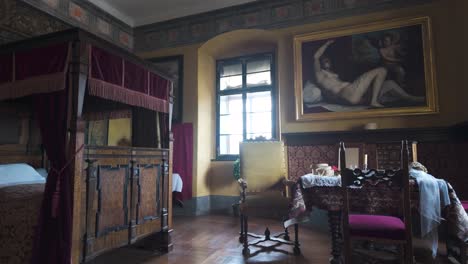 explore the richly decorated bedroom inside cesky krumlov castle. this stately room reflects the grandeur of the bohemian rosenberg family's architectural legacy.