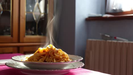 italian traditional cooking, steaming bolognese noodles close-up shot