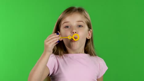 baby lets the soap bubbles green screen baby girl lets multicolored soap bubbles and sincere smiles green screen