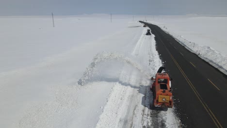 snow plower working in asphalt