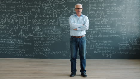 professor in front of a chalkboard full of equations