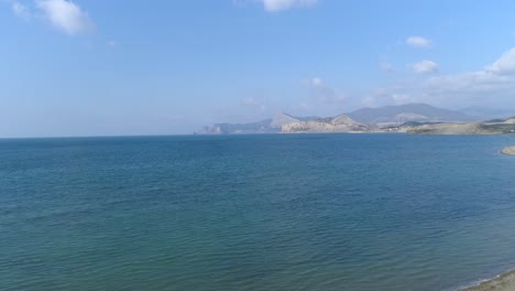 coastal view with mountains and calm water