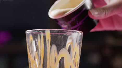 Pouring-hot-vanilla-ice-cream-side-view-Milkshake