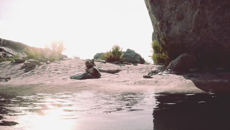 desert landscape with cave and water