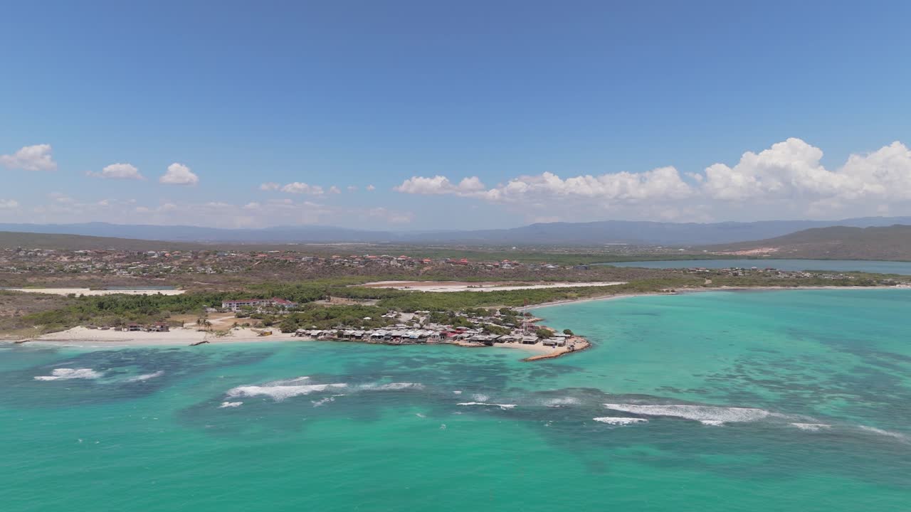 Sliding right aerial view of Hellshire with Portmore city in background