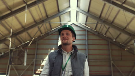 livestock manager walking shed at countryside. farm worker greeting colleague.