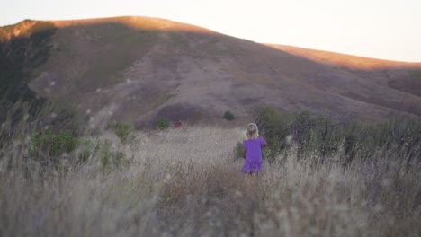 Little-Girls-Runs-to-Catch-Up-with-Mother-While-Hiking-in-the-Mountains