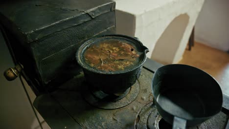 old vintage stove with cooking pot
