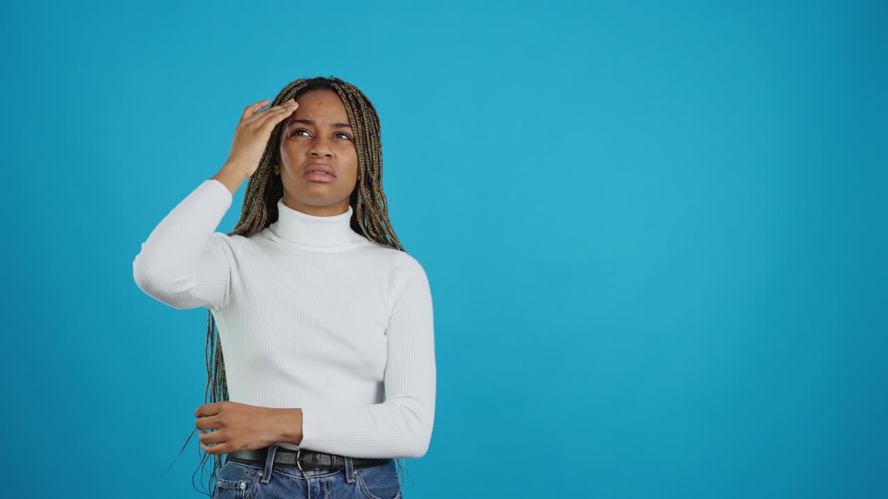 Young woman suffering from headache or discomfort