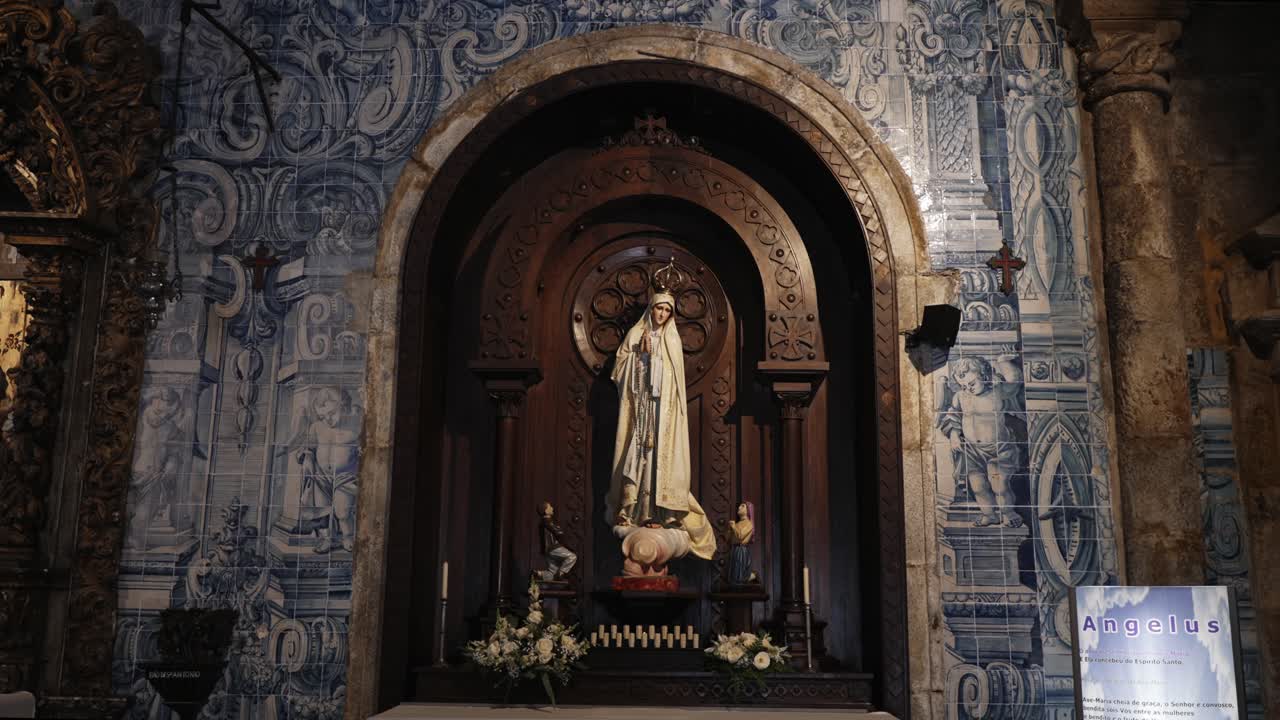 Ornate altar of Our Lady of Fatima, framed by azulejo tiles and wood carvings