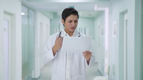 Confused-Indian-doctor-checking-medical-reports