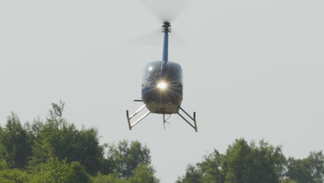 Helicopter-With-Headlights-On-Arriving-In-The-Airport