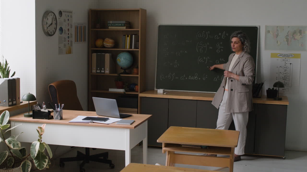 Teacher Explaining Math Concepts in Classroom