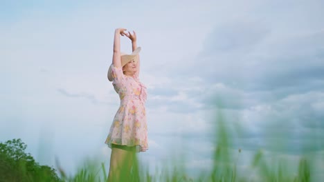 Beautiful-young-Asian-woman-in-dress-stretching-during-walk-in-beautiful-countryside