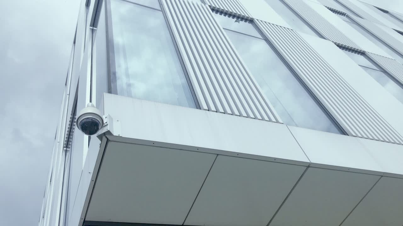 Monitoring outside the building, in the background there is a blue sky with moving clouds, a safe place to work and learn